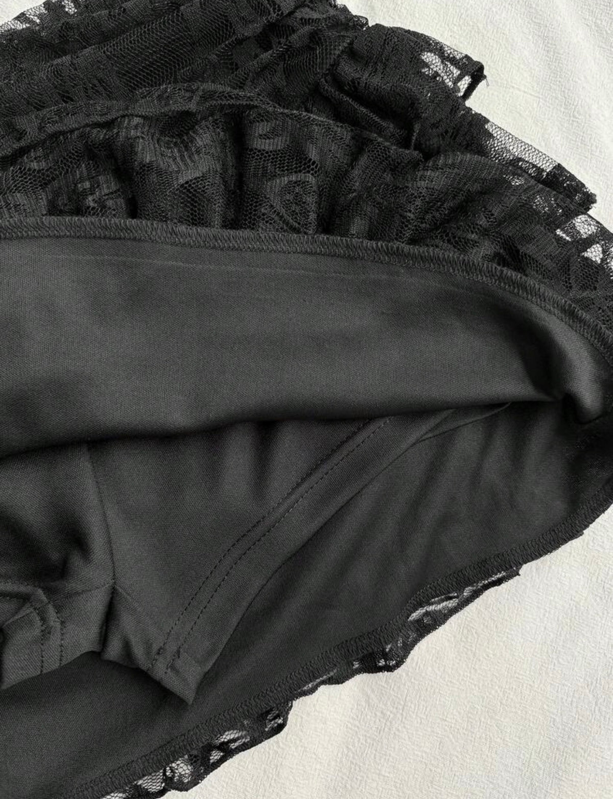 Built-in black shorts beneath the floral lace mini skort
