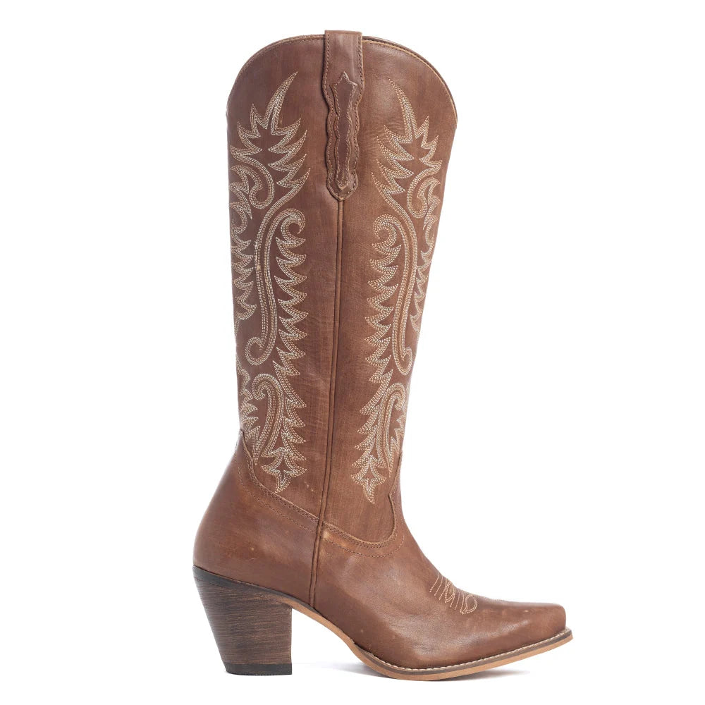 Pair of Myra Sylvia Prairie Bourbon Brown embroidered leather boots outdoors
