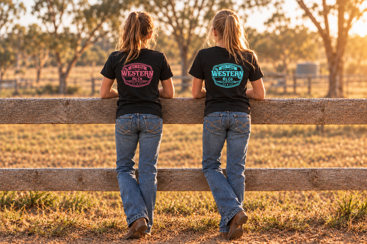 Older girls wearing black Molly Tees with smaller pink and turquoise Western Oz Co logos